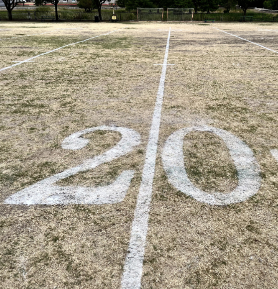 yard line field freshly painted for a charter school