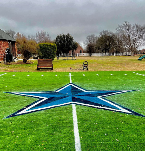 dallas cowboys star logo striped on football field